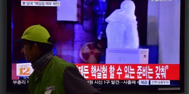 CORRECTION - YEARA man walks past a television display showing a news report at a railroad station in Seoul on January 6, 2016, after seismologists detected a 5.1 magnitude tremor next to North Korea's main atomic test site in the northeast of the country. North Korea said on January 6 it had successfully carried out its first hydrogen bomb test, marking a major step forward in its nuclear development if confirmed. AFP PHOTO / JUNG YEON-JE / AFP / JUNG YEON-JE (Photo credit should read JUNG YEON-JE/AFP/Getty Images)