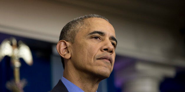 President Barack Obama pauses to listen to question during a news conference in the briefing room at the White House, in Washington, Friday, Dec. 18, 2015. (AP Photo/Carolyn Kaster)