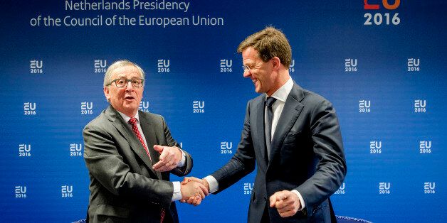 Dutch Prime Minister Mark Rutte, right, greets European Commission President Jean-Claude Juncker prior to a meeting in Amsterdam, Netherlands, Thursday, Jan. 7, 2016. The Netherlands holds the EU presidency for the next six months. (AP Photo/Robin van Lonkhuijsen, Pool)