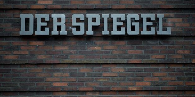 The logo of German publishing house 'Der Spiegel' is pictured on November 29, 2012 at the company's head office in Hamburg, northern Germany. As the chairman of the publishing house said in an interview published on November 29, 2012 at the daily newspaper 'Sueddeutsche Zeitung', the 'Spiegel' group publishing the 'Der Spiegel' weekly magazine plans to react with an austerity plan to a decline in sales, which does not exclude job cuts. AFP PHOTO / JOHANNES EISELE (Photo credit should read