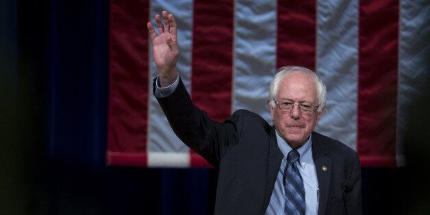 Senator Bernie Sanders, an independent from Vermont and 2016 Democratic presidential candidate, waves as he arrives to speak during a town hall meeting at Timberlane Performing Arts Center in Plaistow, New Hampshire, U.S., on Sunday, Jan. 3, 2016. Sanders' presidential campaign on Saturday said it raised more than $33 million in final three months of 2015 with small contributions making up the majority of the donations. Photographer: Andrew Harrer/Bloomberg via Getty Images