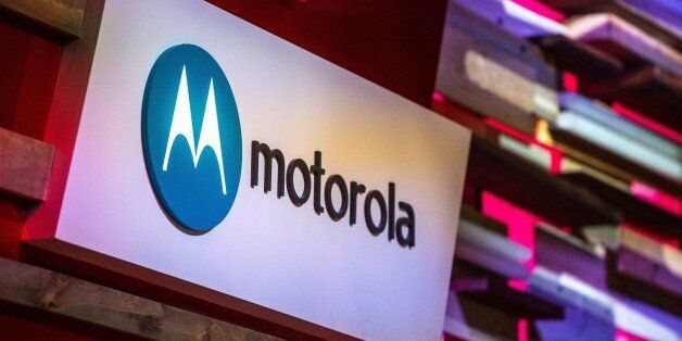 BARCELONA, SPAIN - MARCH 03: A logo sits illuminated outside the Motorola pavilion during the second day of the Mobile World Congress 2015 at the Fira Gran Via complex on March 3, 2015 in Barcelona, Spain. The annual Mobile World Congress hosts some of the wold's largest communication companies, with many unveiling their latest phones and wearables gadgets. (Photo by David Ramos/Getty Images)