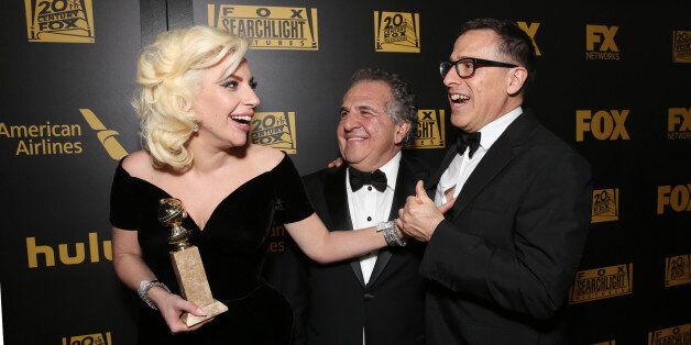 BEVERLY HILLS, CA - JANUARY 10: (L-R) Actress/singer Lady Gaga, winner of Best Performance in a Miniseries or Television Film for 'American Horror Story: Hotel,' Fox Filmed Entertainment Chairman/CEO Jim Gianopulos, and director David O. Russell attend FOX Golden Globe Awards Party 2016 sponsored by American Airlines at The Beverly Hilton Hotel on January 10, 2016 in Beverly Hills, California. (Photo by Todd Williamson/Getty Images for FOX)