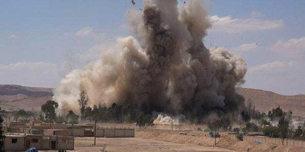 FILE - This photo released on Saturday, May 30, 2015 by a militant website, which has been verified and is consistent with other AP reporting, shows Tadmur prison, blown up and destroyed by the Islamic State group in Palmyra (Tadmur in Arabic), Homs province, Syria. The prison was where government opponents were held, and reports over the years said it was the site of beatings and torture. (Militant website via AP, File)