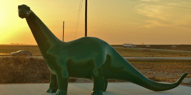 Not photo shopped. This is a dinosaur at a Sinclair gas station somewhere in the middle of Iowa on US Route 20.