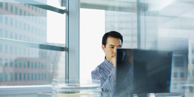 Businessman working at desk in office