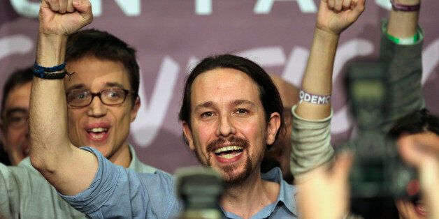 Podemos party leader Pablo Iglesias celebrates before talking to the press following the latest official results in Madrid, Sunday, Dec. 20, 2015. A strong showing by upstart parties Podemos and Ciudadanos is threatening to upend the country's traditional two-party system in Spain's general election, with exit polls and early results projecting that the ruling Popular Party won the most votes but fell far short of a parliamentary majority and risks being booted from power.(AP Photo/Emilio Morenatti)