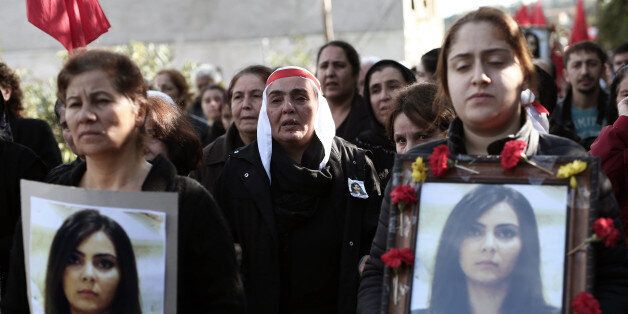 Family members and friends mourn for Dilek Dogan, a 25-year-old woman who was shot at her home during police operation and lost her life after eight days in intensive care Sunday night in Istanbul, Turkey, Monday, Oct. 26, 2015. Police said Dilek Dogan was injured in a clash during a police raid, but her family allege that police shot her during an argument. (AP Photo)