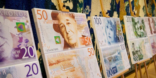 Artwork showing the designs of new folding Swedish krona, or kronor, currency notes due to be issued in 2014 stands on display at the Riksbank in Stockholm, Sweden, on Tuesday, Jan. 22, 2013. Sweden is struggling with the fallout from Europe's debt crisis, which has led to a slump in exports, about 70 percent of which go to Europe. Photographer: Casper Hedberg/Bloomberg via Getty Images