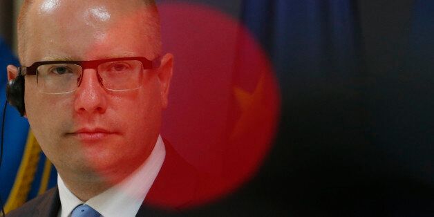 Czech Prime Minister Bohuslav Sobotka listens questions during a press conference after talks with his Serbian counterpart Aleksandar Vucic, unseen, in Belgrade, Serbia, Tuesday, Sept. 1, 2015. Sobotka arrived on a two-day official visit to Serbia. (AP Photo/Darko Vojinovic)