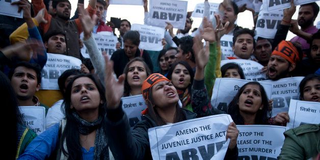 Members of Indian students organization ABVP shout slogans as they protest the release of a juvenile convicted in the fatal 2012 gang rape that shook the country in New Delhi, India, Sunday, Dec.20, 2015. The man, who was short of his 18th birthday at the time of the crime, was to finish his three-year term in a reform home on Sunday.Several activists and politicians have demanded that he not be released until it can be proven that he has been reformed. (AP Photo /Tsering Topgyal)