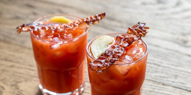 Two glasses of Bloody Mary with bacon rashers