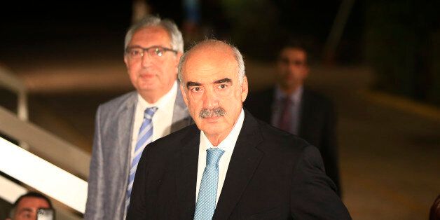 Vangelis Meimarakis, head of Greece's main opposition conservative New Democracy party, arrives for a live televised debate with former Greek Prime Minister Alexis Tsipras, and the leader of the left-wing Syriza party at the state-run ERT television in Athens, Monday, Sept. 14, 2015. Greece is holding a snap general election on Sept. 20, 2015. (AP Photo/Lefteris Pitarakis)