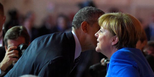 US President Barack Obama speaks with German Chancellor Angela Merkel at the UN conference on climate change - COP21, on November 30, 2015 at Le Bourget, on the outskirts of the French capital Paris. World leaders opened an historic summit in the French capital with 'the hope of all of humanity' laid on their shoulders as they sought a deal to tame calamitous climate change. AFP PHOTO / ALAIN JOCARD / AFP / ALAIN JOCARD (Photo credit should read ALAIN JOCARD/AFP/Getty Images)