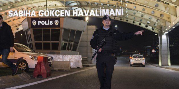 ISTANBUL, TURKEY - DECEMBER 23: Turkish security forces and firefighters take security measures after an explosion, at Sabiha Gokcen Airport in Istanbul, Turkey on December 23, 2015. Unknown explosion left 2 wounded airport worker, officials said. The cause of the explosion remains unknown on the early morning of the day. (Photo by Arif Hudaverdi Yaman/Anadolu Agency/Getty Images)