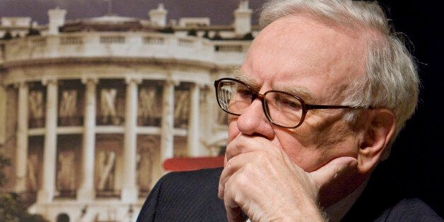** FILE ** In this Aug. 21, 2008 file photo, billionaire investor Warren Buffett listens to panelists during a news conference ahead of the screening of a movie called