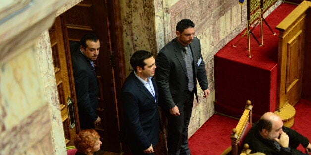 GREEK PARLIAMENT, ATHENS, GREECE - 2015/12/15: Prime Minister of Greece Alexis Tsipras (Centre) is entering the hall of Greek Parliament during the session of Prior Action Multi Bill. Greek Parliament with the affirmative vote of all 153 members of Syriza and Independent Greeks parties that form Greek Government adopted the new package of prerequisite measures (Prior Action Multi Bill). (Photo by Dimitrios Karvountzis/Pacific Press/LightRocket via Getty Images)