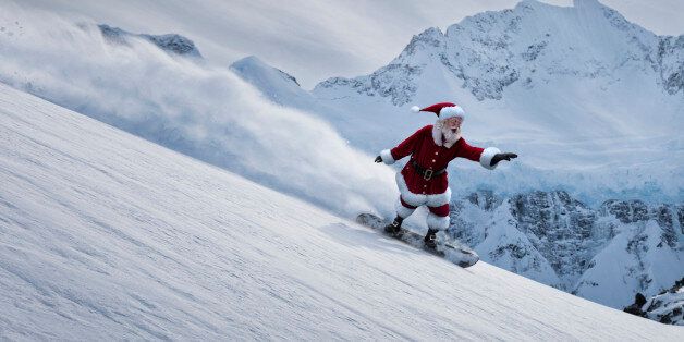Santa Claus flying down a mountain on a snowboard with powder flying behind