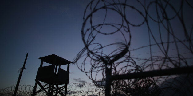 GUANTANAMO BAY, CUBA - JUNE 27: (EDITORS NOTE: Image has been reviewed by the U.S. Military prior to transmission.) A watch tower is seen in the currently closed Camp X-Ray which was the first detention facility to hold 'enemy combatants' at the U.S. Naval Station on June 27, 2013 in Guantanamo Bay, Cuba.The U.S. Naval Station at Guantanamo Bay, houses the American detention center for 'enemy combatants'. President Barack Obama has recently spoken again about closing the prison which has been used to hold prisoners from the invasion of Afghanistan and the war on terror since early 2002. (Photo by Joe Raedle/Getty Images)