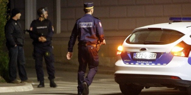 Bosnian police are seen as they secure the perimeter around the police station in the town of Zvornik, in the Serb-run part of Bosnia, Republika Srpska, late on April 27, 2015. One policeman was killed and two others were wounded in the eastern Bosnian town of Zvornik when a man opened fire on a police station shouting 'Allah Akbar', officials said. The gunman was also killed in the exchange of fire, a police spokeswoman Aleksandra Simojlovic told reporters, calling it a 'terrorist' attack. AFP PHOTO / STR (Photo credit should read -/AFP/Getty Images)