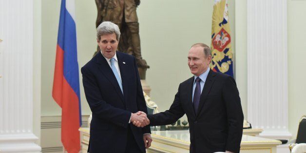US Secretary of State John Kerry, left, shakes hands with Russia's President Vladimir Putin during a meeting at the Kremlin in Moscow Tuesday, Dec. 15, 2015. The United States and Russia need to find