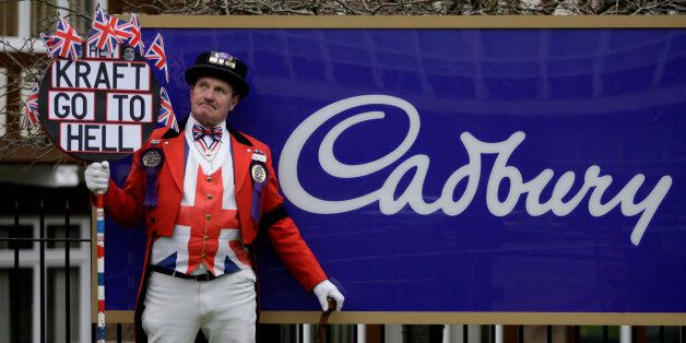 British protester Ray Egan, dressed as the fictional personification of Britain's John Bull, protests against the sale of Cadbury, outside their headquarters in Birmingham, England, Tuesday, Jan. 19, 2010. British candy maker Cadbury PLC on Tuesday accepted Kraft's improved takeover offer worth $19.5 billion, potentially ending a months-long corporate battle to create the world's largest maker of chocolate and sweets. The U.S. food conglomerate said the board of Cadbury, maker of Creme Eggs and