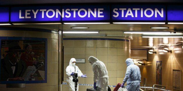 LONDON, UNITED KINGDOM - DECEMBER 05: Police officers and crime scene investigators investigate a crime scene at Leytonstone tube station in east London, England, on December 05, 2015 after a man was seriously injured in a knife attack and it is treated as a terror attack because the attacker reportedly shouted 'This is for Syria' during the attack. (Photo by Tolga Akmen/Anadolu Agency/Getty Images)