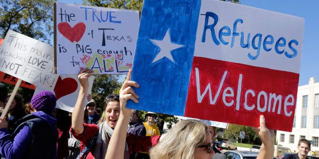 AUSTIN, TX - NOVEMBER 22: Members of The Syrian People Solidarity Group protest on November 22, 2015 in Austin, Texas. The group was protesting Texas governor Greg Abbott's refusal to allow Syrian refugees in the state. (Photo by Erich Schlegel/Getty Images)