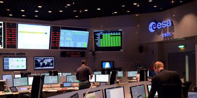 DARMSTADT, GERMANY - DECEMBER 03: Technicians and flight control operators sit at computers in the control room of the European Space Operations Centre (ESA/ESOC) shortly before the launch of the LISA Pathfinder on December 2, 2015 in Darmstadt, Germany. The LISA Pathfinder is a probe that will test technologies required for the gravitational wave observatory, which is another probe scheduled for launch in 2034. The actual launch today of the LISA Pathfinder is taking place in French Guiana. (Photo by Thomas Lohnes/Getty Images)
