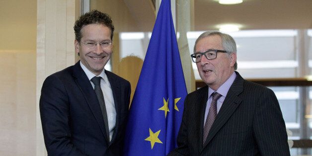 European Commission President Jean-Claude Juncker, right, shakes hands with President of the Eurogroup Jeroen Dijsselbloem before a Eurogroup finance ministers meeting at the EU Council in Brussels on Monday, Nov 9, 2015. (AP Photo/Francois Walschaerts)
