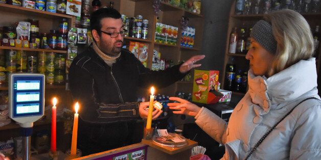 YALTA, CRIMEA, RUSSIA - NOVEMBER 28: People buying candles in a shop on November 28, 2015 in Yalta, Crimea, Russia. Crimea declared a state of emergency on November 22, 2015 after its main electricity lines from Ukraine were blown up, leaving the Russian-annexed peninsula in darkness after the second such attack in as many days. (Photo by Victor Korotayev/Kommersant Photo via Getty Images)