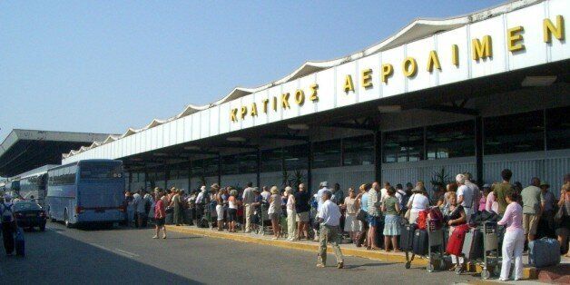 Aaaaaagh! Hyuge queue in 40 degree heat outside the (full) airport terminal building in Corfu. NOT fun.