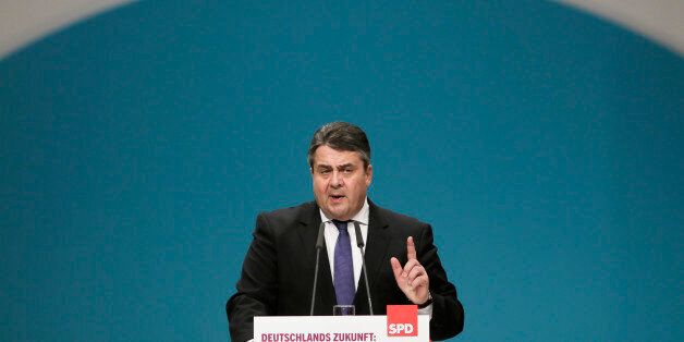German Social Democratic Party, SPD, chairman Sigmar Gabriel delivers his speech during the party convention in Berlin, Friday, Dec. 11, 2015. Slogan reads: Germany's Future: Secure, Fair, Open-Minded. Germanyâs vice chancellor has warned against the rise of nationalism in Europe, citing the far-right National Front that scored strongly in recent French regional elections. Sigmar Gabriel told members of his Social Democratic Party on Friday that movements such as the National Front âstand against everything we represent.â(AP Photo/Markus Schreiber)