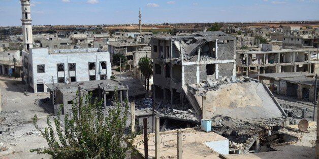 A picture taken on September 30, 2015 shows a general view of deserted streets and damaged buildings in the central Syrian town of Talbisseh in the Homs province. Russia confirmed on Septemer 30 that it carried out its first airstrike in Syria, near the city of Homs, marking the formal start of Moscow's military intervention in the 4.5-year-old conflict. AFP PHOTO / MAHMOUD TAHA (Photo credit should read MAHMOUD TAHA/AFP/Getty Images)