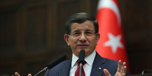 ANKARA, TURKEY - DECEMBER 8: Turkish Prime Minister and the leader of the Justice and Development Party (AK Party) Ahmet Davutoglu delivers a speech during AK Party's group meeting at the Grand National Assembly of Turkey (TBMM) in Ankara, Turkey on December 8, 2015. (Photo by Halil Sagirkaya/Anadolu Agency/Getty Images)