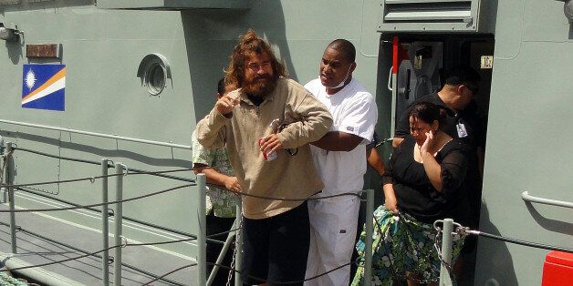 Salvadorean castaway who identified himself as Jose Ivan and later told that his full name is Jose Salvador Alvarenga steps off the 'Lomor' Sea Patrol vessel in Majuro with the help of a Majuro Hospital nurse after a 22-hour boat ride from isolated Ebon Atoll on February 3, 2014. Jose Ivan was washed up on Ebon Atoll on January 30, 2014, and told his rescuers he set sail from Mexico for El Salvador in September 2012 and has been floating on the ocean ever since. AFP PHOTO / Giff Johnson (Photo credit should read GIFF JOHNSON/AFP/Getty Images)