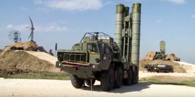 This photo made from the footage taken from Russian Defense Ministry official web site on Friday, Nov. 27, 2015, shows Russian S-400 air defense missiles being deployed at the Hemeimeem air base in Syria, about 50 kilometers (30 miles) south of the border with Turkey. Russiaâs President Vladimir Putin has ordered the deployment of the S-400s to the Russian base in Syria to help protect Russian warplanes after Turkey downed a Russian military jet at the border with Syria on Tuesday. (Russian Defense Ministry Press Service pool photo via AP)