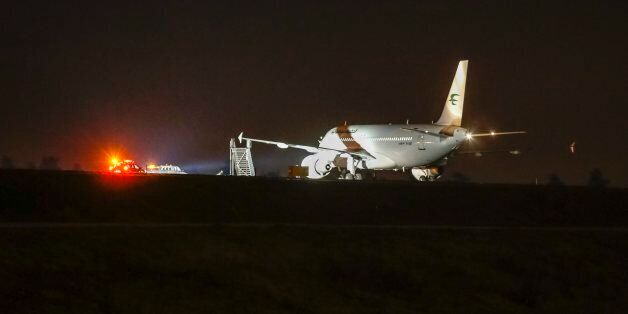 An Iraqi Airways Airbus A320-214 passenger jet stands on a cordoned-off area of the apron at Arlanda Airport, Stockholm, Sweden, Wednesday evening Feb. 26, 2014, after a bomb threat was received against the plane which was scheduled to take off for Baghdad, Iraq at 12:30. (AP photo/ Fredrik Persson, TT News Agency) ** SWEDEN OUT **