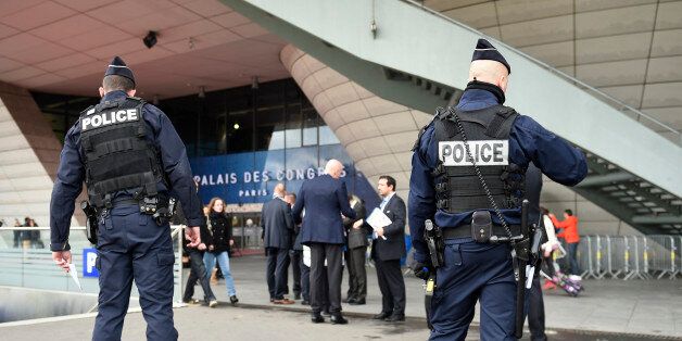 French police officers patrol outside the Palais des Congres in Paris on December 12, 2015, ahead of the draw for the Euro 2016 finals. Paris hosts the draw for the Euro 2016 finals on December 12 evening, with less than six months now to go before the start of the first 24-team tournament in the competition's history. The coaches of the competing nations will be in attendance in the French capital to find out who their sides will come up against in the group stage of the European Championship,