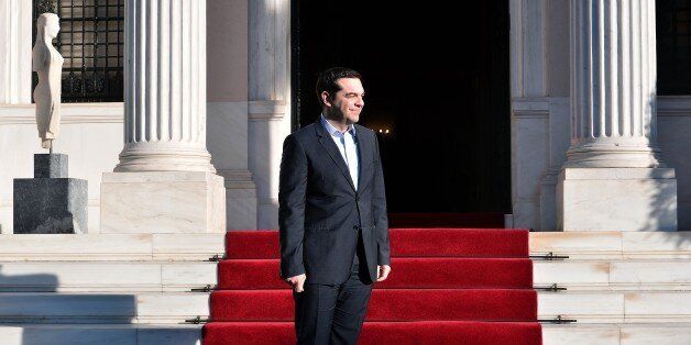 Greek Prime Minister Alexis Tsipras waits for the arrival of Egyptian President Abdel Fattah al-Sissi prior to their meeting in Athens on December 8, 2015. Sissi started a two-day visit to Greece for talks focused on energy cooperation. / AFP / LOUISA GOULIAMAKI (Photo credit should read LOUISA GOULIAMAKI/AFP/Getty Images)