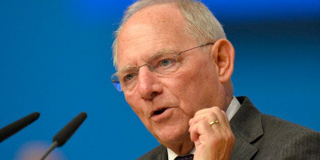 German Finance Minister Wolfgang Schaeuble talks to the delegates during the annual federal congress of the German Christian Union (CDU) in Karlsruhe, southern Germany, on December 14, 2015. AFP PHOTO / THOMAS KIENZLE / AFP / THOMAS KIENZLE (Photo credit should read THOMAS KIENZLE/AFP/Getty Images)