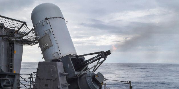 SOUTH CHINA SEA (Oct. 8, 2014) The close-in weapon system (CIWS) fires 20mm rounds during detect-to-engage exercises aboard the amphibious assault ship USS Peleliu (LHA-5). Peleliu is the lead ship in the Peleliu Expeditionary Strike Group, commanded by Rear Adm. Hugh Wetherald, and is conducting joint forces exercises in the U.S. 7th Fleet area of responsibility. (U.S. Navy photo by Mass Communication Specialist 1st Class Joshua Hammond/Released)