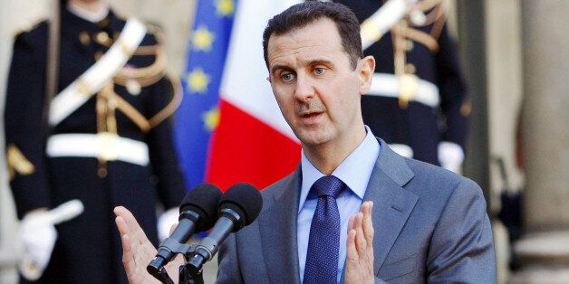 FILE - In this Thursday Dec. 9, 2010 file photo, Syria President Bashar al-Assad addresses reporters following his meeting with French President Nicolas Sarkozy at the Elysee Palace in Paris, France. Syrian President Bashar Assad says the French and Syrian intelligence services have had âsome contactsâ over the fight against the Islamic State group but denied that there is any cooperation between them. Assad made the remarks in a taped interview with French television station France 2 broadcast Monday April 20, 2015. (AP Photo/Remy de la Mauviniere, File)