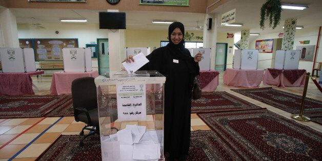 JEDDAH, SAUDI ARABIA- DECEMBER 12: A Saudi woman casts her vote for the municipal elections at a polling station on December 12, 2015 in Jeddah, Saudi Arabia. Saudi Women are running the municipal council seats as candidates for the first time in the Kingdom's history and also be allowed for the first time to vote in a governmental election. The Municipal councils are the only government body in which Saudi Arabian citizens can elect representatives, so the vote is widely seen as a small but significant opening for women to play a more equal role in society. (Photo by Jordan Pix/ Getty Images)