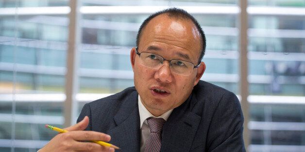 Billionaire Guo Guangchang, chairman and chief executive officer of Fosun Group, speaks during an interview in New York, U.S., on Thursday, April 23, 2015. Guo is the largest shareholder of Shanghai-based Fosun Group, China's biggest closely-held investment firm, with interests in real estate, retailing and gold mining. Photographer: Michael Nagle/Bloomberg via Getty Images