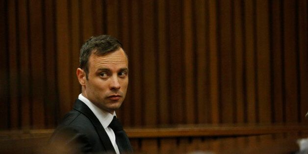 Oscar Pistorius sits in the dock at a courtroom of the North Gauteng High Court in Pretoria, South Africa, Tuesday Dec. 8, 2015. Pistorius arrived in the South African courtroom, where he is expected to apply for bail following his conviction for murdering girlfriend Reeva Steenkamp. (AP Photo/Siphiwe Sibeko, Pool)
