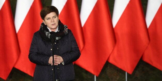 MALBORK, POLAND - NOVEMBER 23: (SOUTH AFRICA AND POLAND OUT) Prime Minister Beata Szydlo addresses those brought in from the areas of Mariupol and Donbass in the Ukraine on November 23, 2015 at the 22nd Polish Air Force Base in Malbork, Poland. Ukrainian citizens with Polish origin arrived in Poland as a part of the program of resettlement for Poles from the war torn regions in the Ukraine (Photo by Michal Fludra/Getty Images Poland/Getty Images)