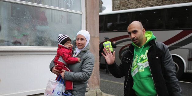 ROTHESAY, ISLE OF BUTE, SCOTLAND - DECEMBER 04: Syrian refugee families arrive at their new homes on the Isle of Bute on December 4, 2015 in Rothesay, Isle of Bute, Scotland. The Isle of Bute is welcoming 15 Syrian Refugee families as part of the governments plant to give refuge to 20,000 refugees in the UK by 2020. The Isle of Bute, on the Cowal peninsular, has a population of 6,498 which swells in the Summer months due to tourism. The island has been nicknamed the 'Madeira of Scotland' (Phot