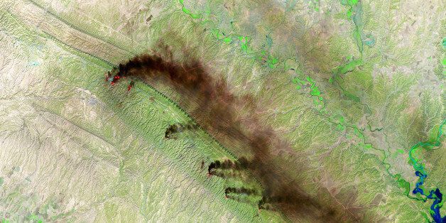 BAGHDAD, IRAQ NOVEMBER 12: (SOUTH AFRICA OUT) A Shortwave Infrared (SWIR) satellite view of the Baiji North Oil Refinery on November 12, 2015 in Baghdad, Iraq. Fires and dark plumes of smoke seen pouring from the Hamrin Mountains near the Baiji North Oil Refinery and oil fields in Iraq. Various heat sources are visible throughout the mountain range. (Photo by USGS/NASA Landsat/Orbital Horizon/Gallo Images/Getty Images)