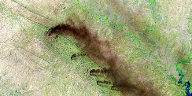 BAGHDAD, IRAQ NOVEMBER 12: (SOUTH AFRICA OUT) A Shortwave Infrared (SWIR) satellite view of the Baiji North Oil Refinery on November 12, 2015 in Baghdad, Iraq. Fires and dark plumes of smoke seen pouring from the Hamrin Mountains near the Baiji North Oil Refinery and oil fields in Iraq. Various heat sources are visible throughout the mountain range. (Photo by USGS/NASA Landsat/Orbital Horizon/Gallo Images/Getty Images)